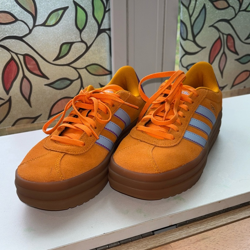 Adidas Orange and Purple Sneakers with Iconic Stripes